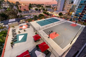 an aerial view of a basketball court and courts in a city